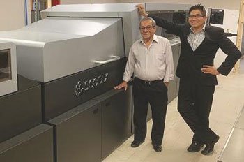 APD Printing General Manager Luis Perez and company President Gregory Perez with their new Scodix Ultra 101 digital enhancement press