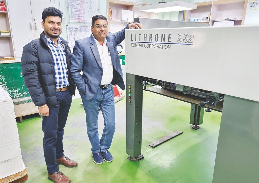 Akshat and Sandeep Jain with their first Komori press